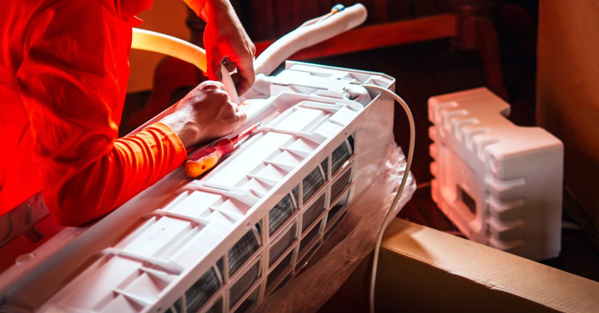 air-conditioning-technicians-prepare-to-install-new-aircon